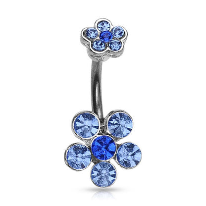A flower belly button ring with blue gemstone petals on a white background.