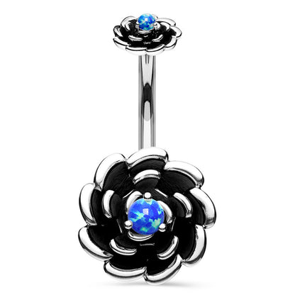 Navel ring with silver-colored flower design and blue synthetic opal in the center on a white background.