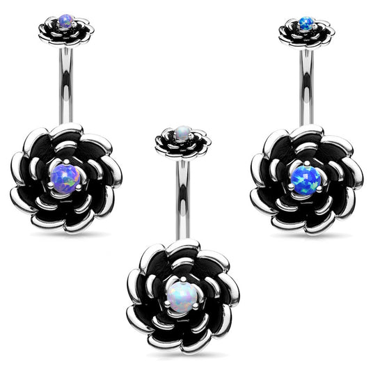 Set of three antique silver rose belly button rings with a different color of opal in the center of each on a white background.