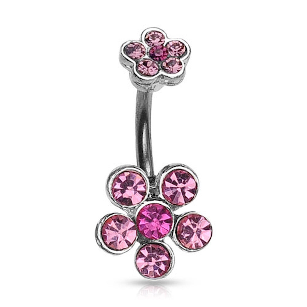 A flower belly button ring with pink gemstone petals on a white background.